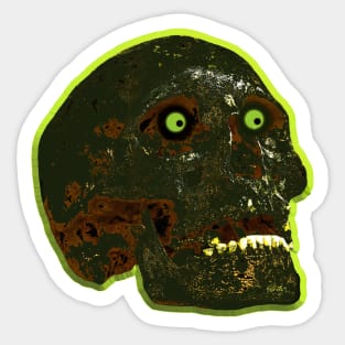 Burnt skull with glowing green eyes Sticker